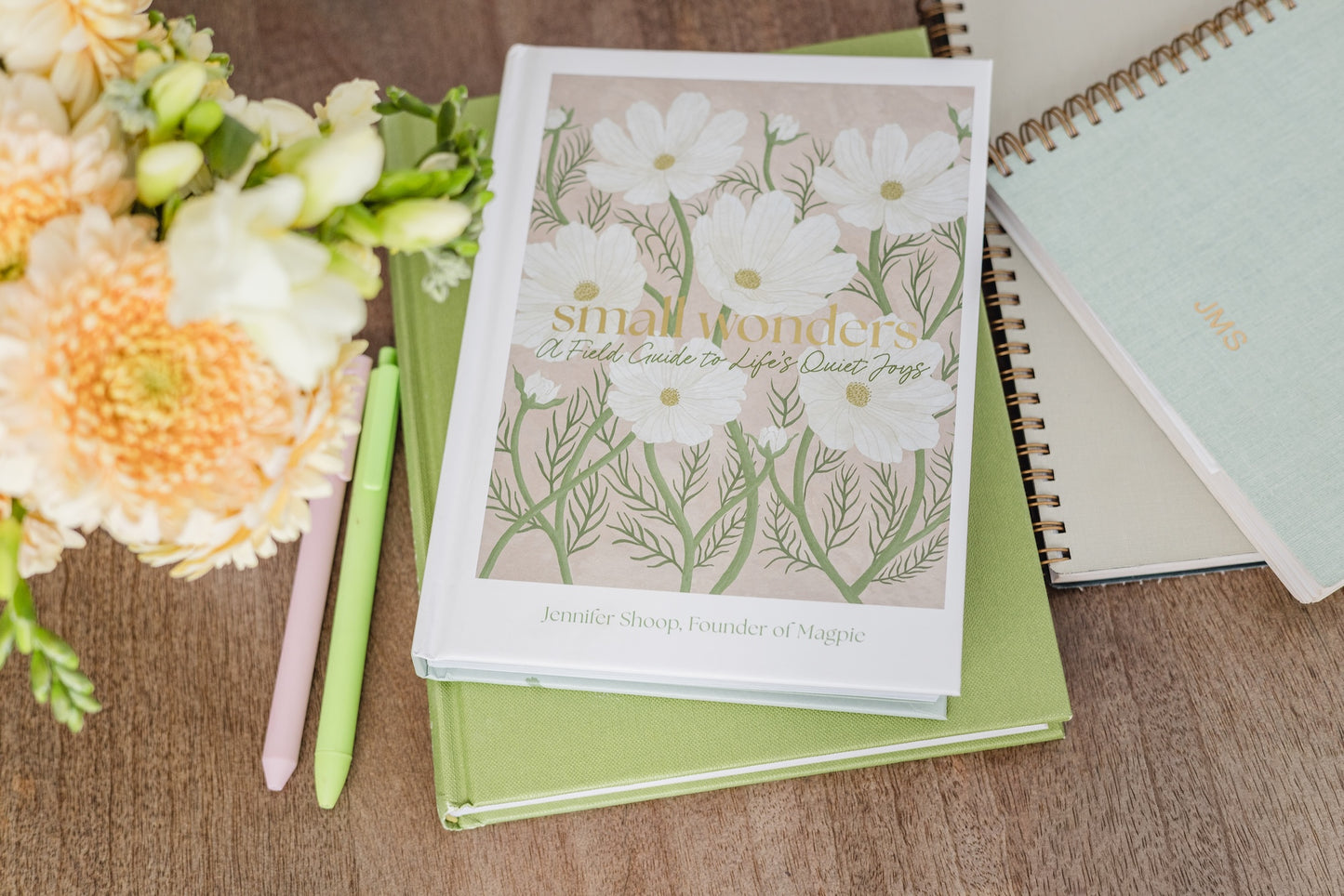 Small Wonders book styled with flowers and stationery
