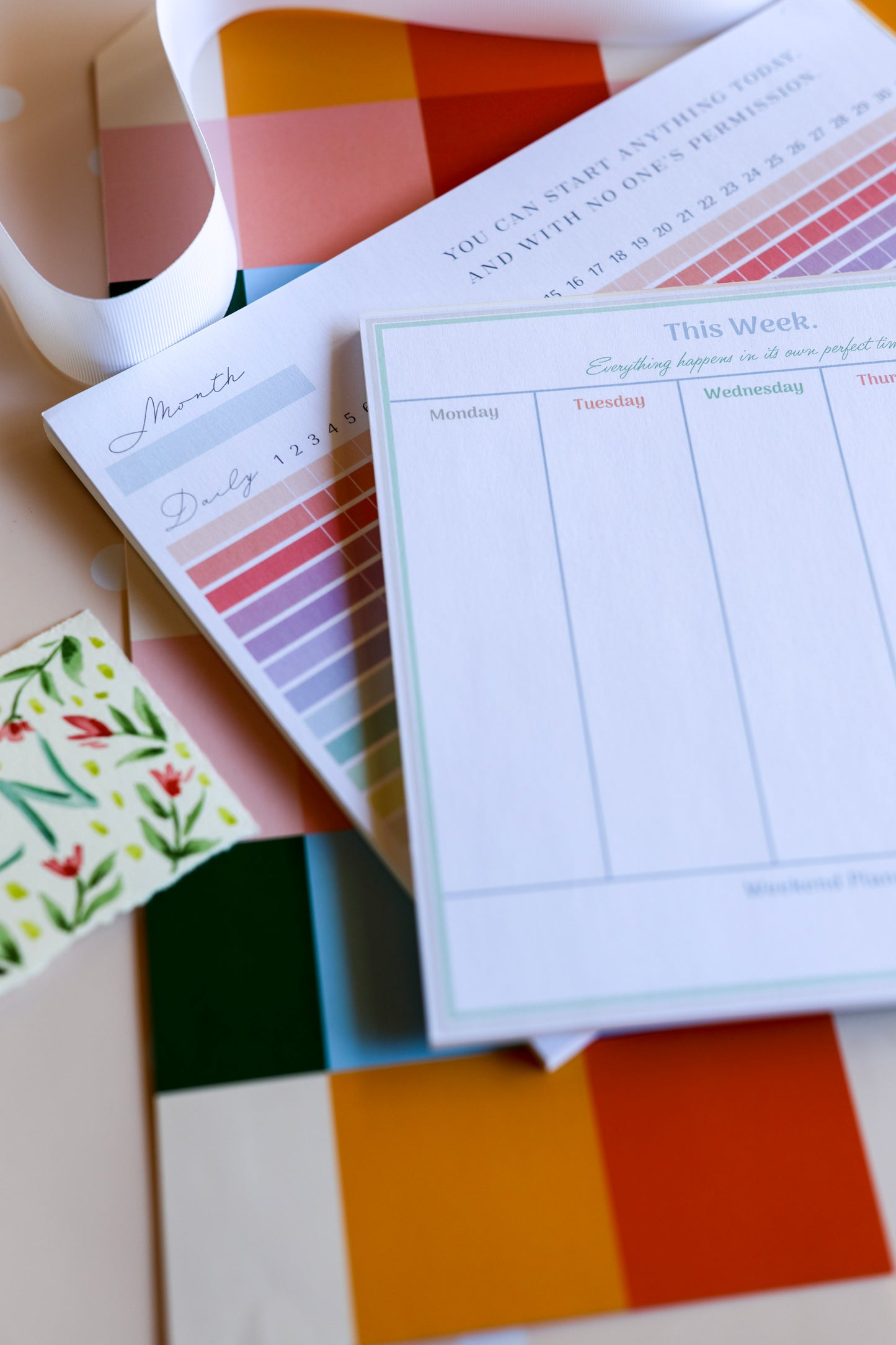 Overhead image of Magpie x Mamey habit tracker and weekly planner, styled for gifting.