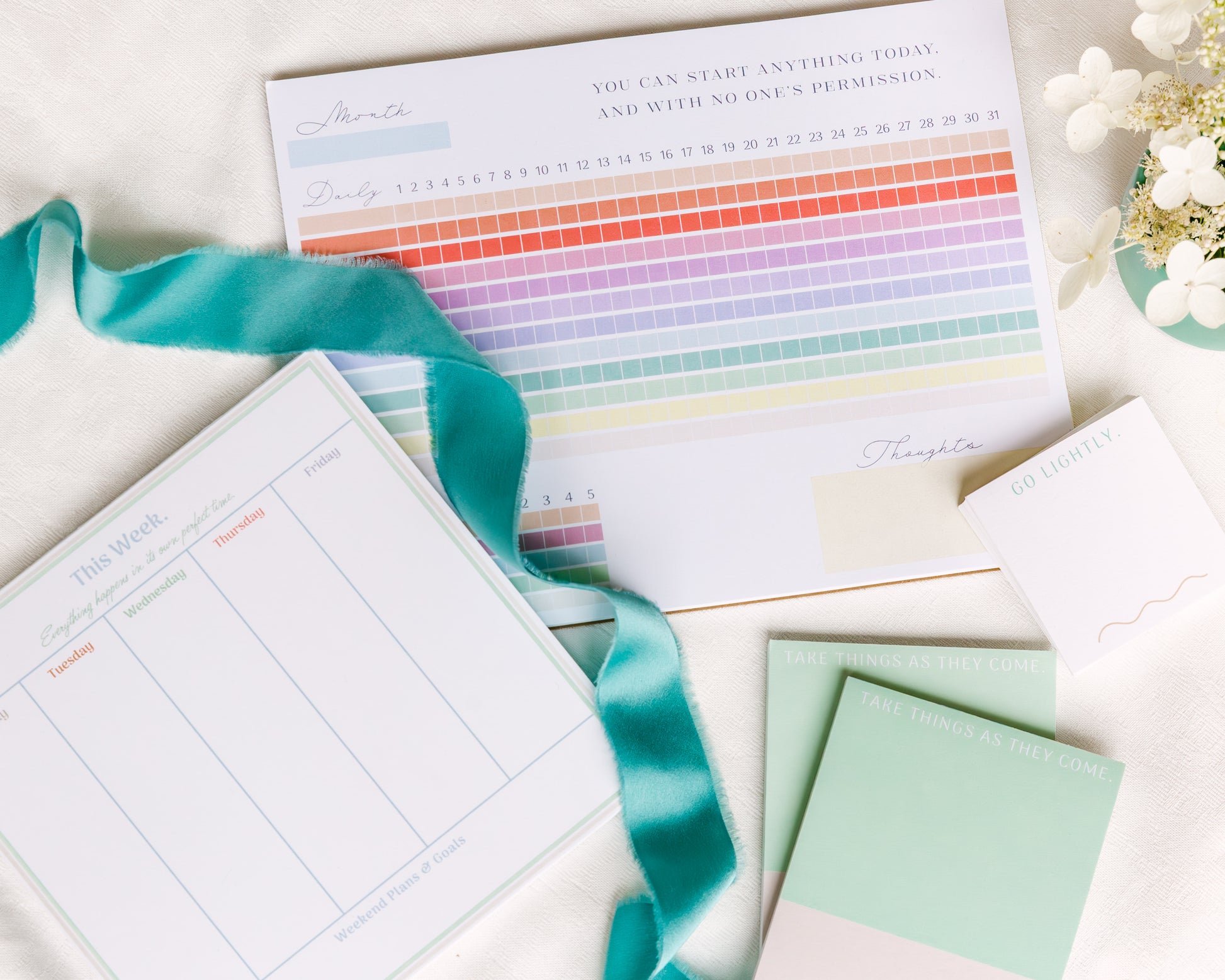 Magpie x Mamey stationery collection featuring notepad, habit tracker, weekly planner, and post-its with floral accents