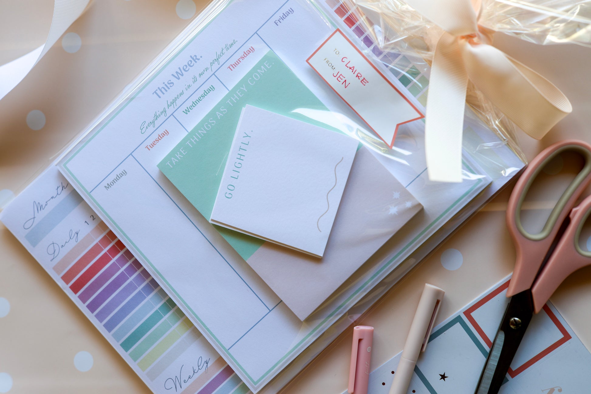 Styled flat lay of Magpie x Mamey Suite showing planner, post-its, and note pads.